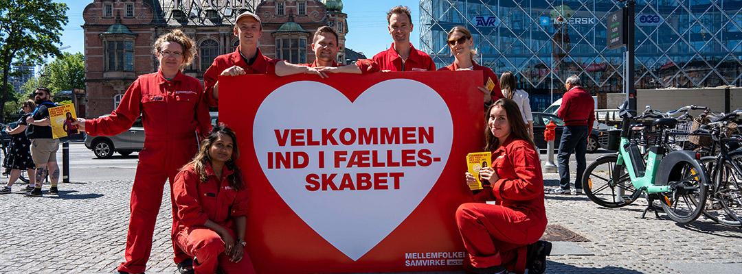 Velkommen ind i fællesskabet - Mellemfolkeligt Samvirke banner